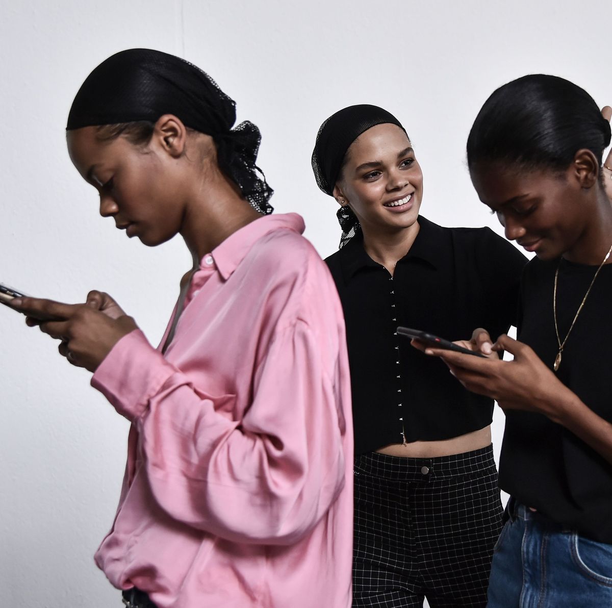 models check their mobile phone as they wait in the backstage before the philosophy di lorenzo serafini fashion show, as part of the womens springsummer 2019 fashion week in milan, on september 22, 2018 photo by marco bertorello  afp        photo credit should read marco bertorelloafp via getty images