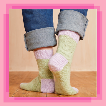a pair of feet in green and pink socks