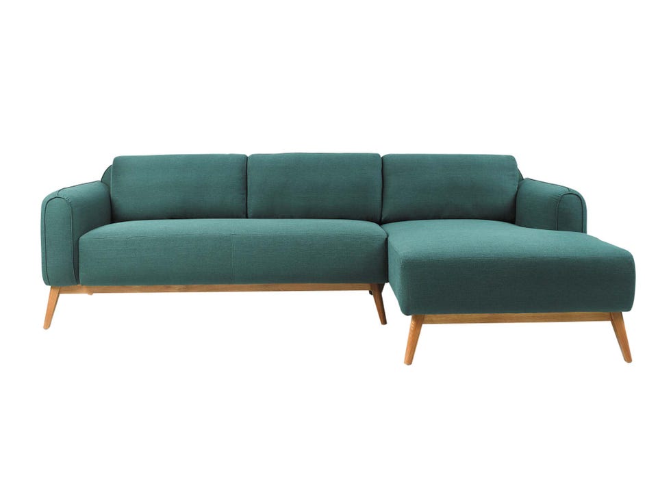 sofá en tono verde que incluye chaise longue
