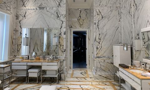 all marble bathroom in beaux arts style, italian marbles, everything hand carved, the furniture is from oasis, an italian brand
