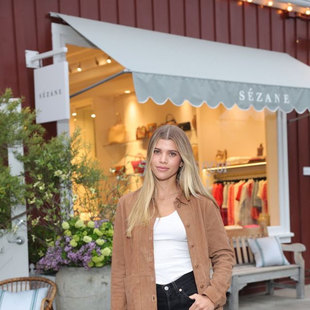 Sofia Richie flashes her abs in a cropped vest and a $3,000 Louis Vuitton  logo PJ top