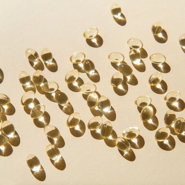 soft vitamin d capsules on a beige background