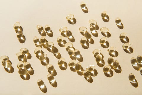 soft vitamin d capsules on a beige background