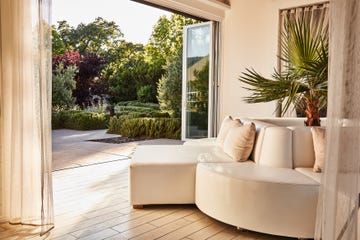 modern indoor seating area with an open view to a garden