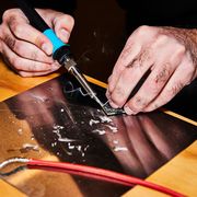 soldering iron in use