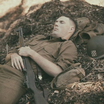 ww2 soldier taking a nap on mulch