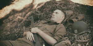 ww2 soldier taking a nap on mulch