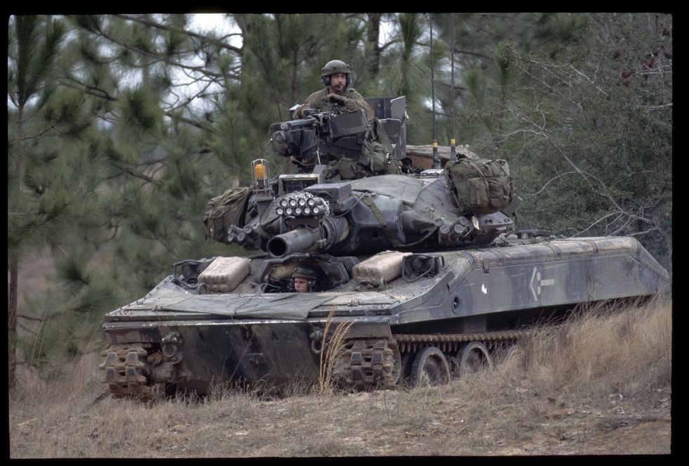 soldiers operating sheridan tank while training