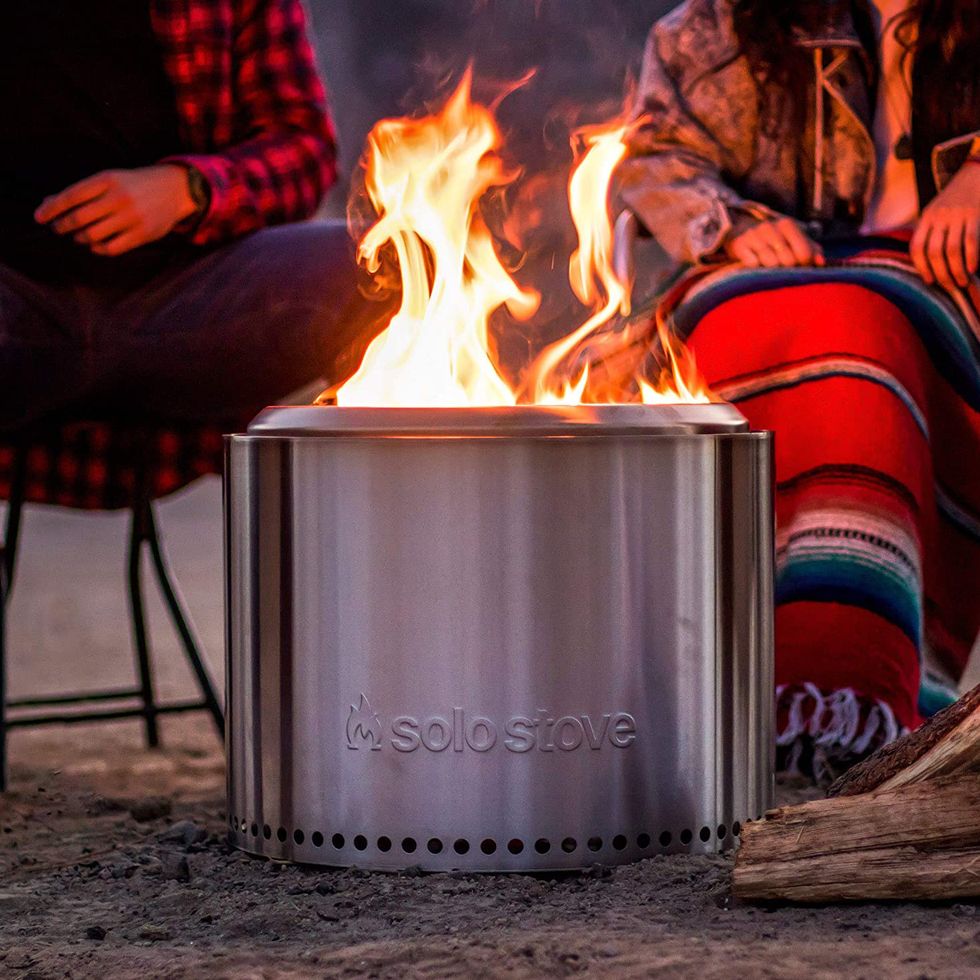 people sitting by solo stove outdoor fire pit