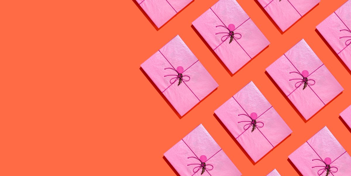 some pink gift boxes on orange background books