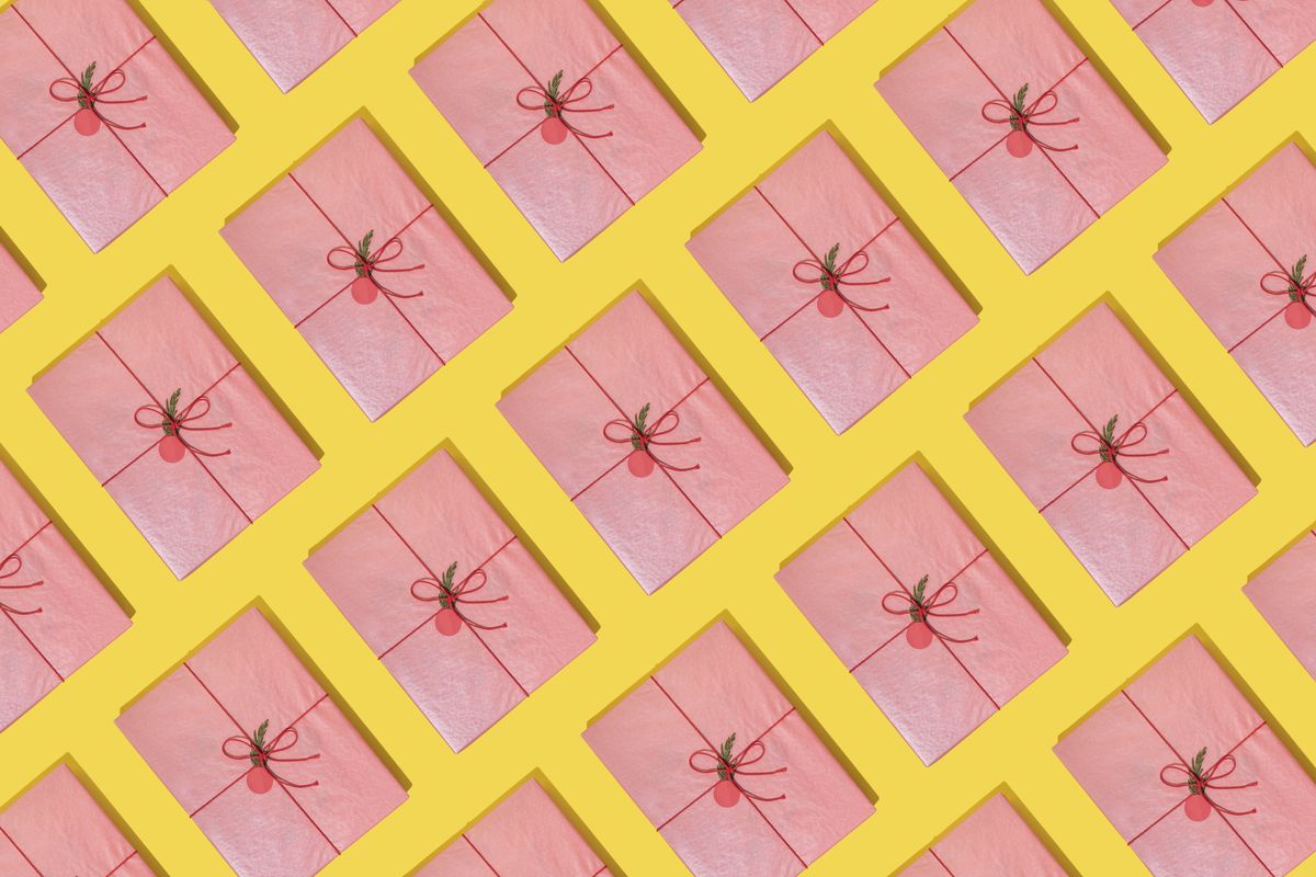 some pink gift boxes on yellow background