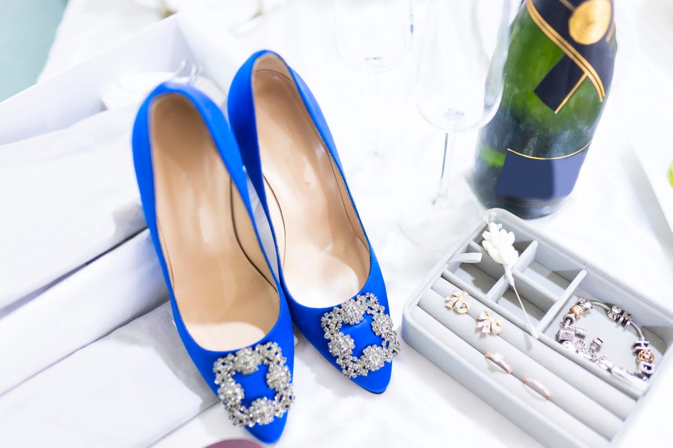 champagne, blue wedding shoes and bridal accessories