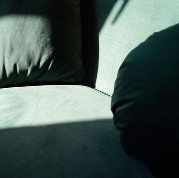 a person's foot on a bed