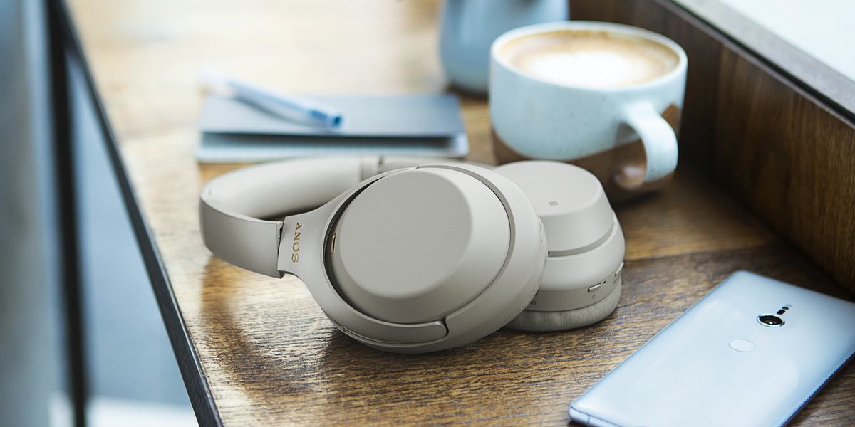 sony headphones on counter with coffee and phone