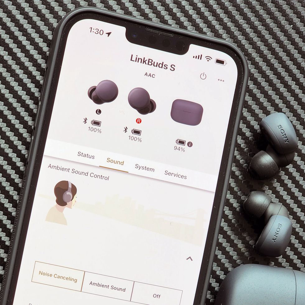 linkbuds s app next to earbuds and charging case