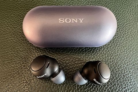 sony wf c500 wireless earbuds and case on leather background