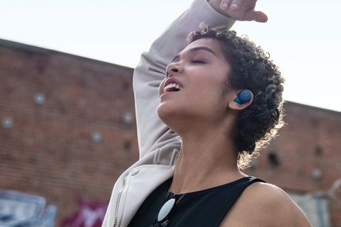woman dancing with sony wf xb700 extra bass wireless earbuds in