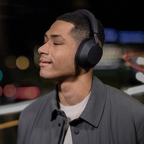 person wearing sony wh1000xm5 headphones
