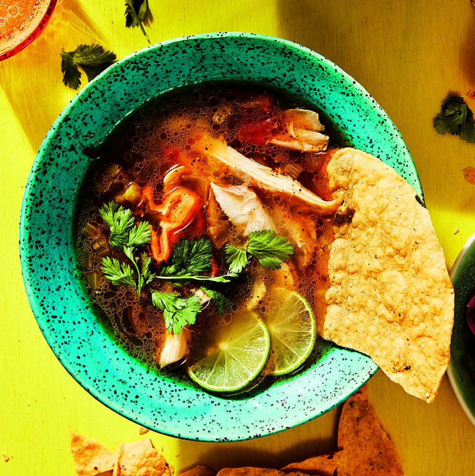 sopa de lima with chicken, tortillas, and lime