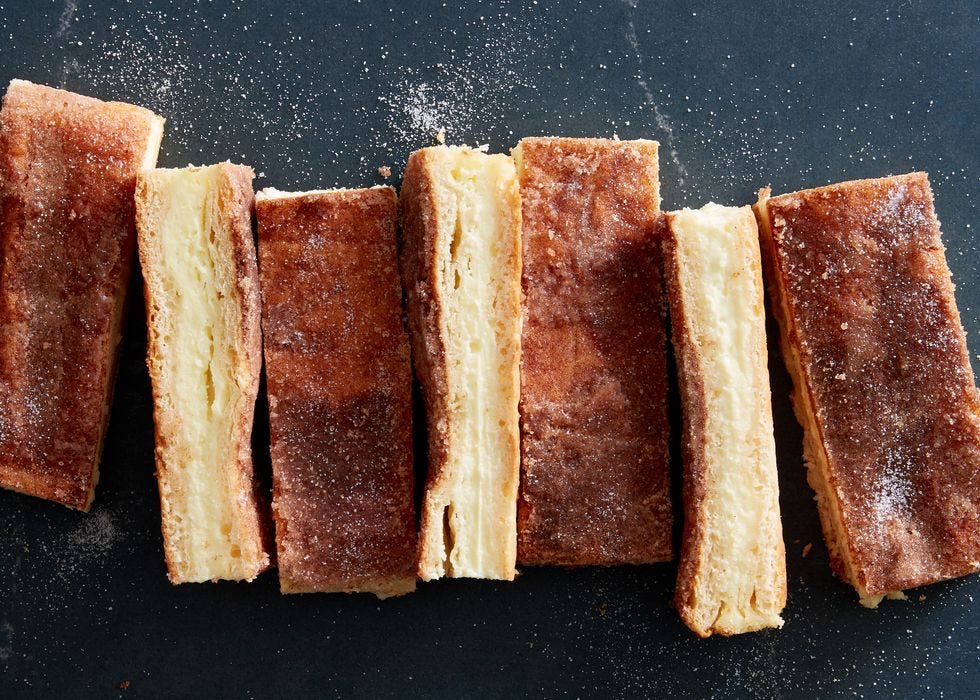 slices of sopapilla cheesecake on a dark background
