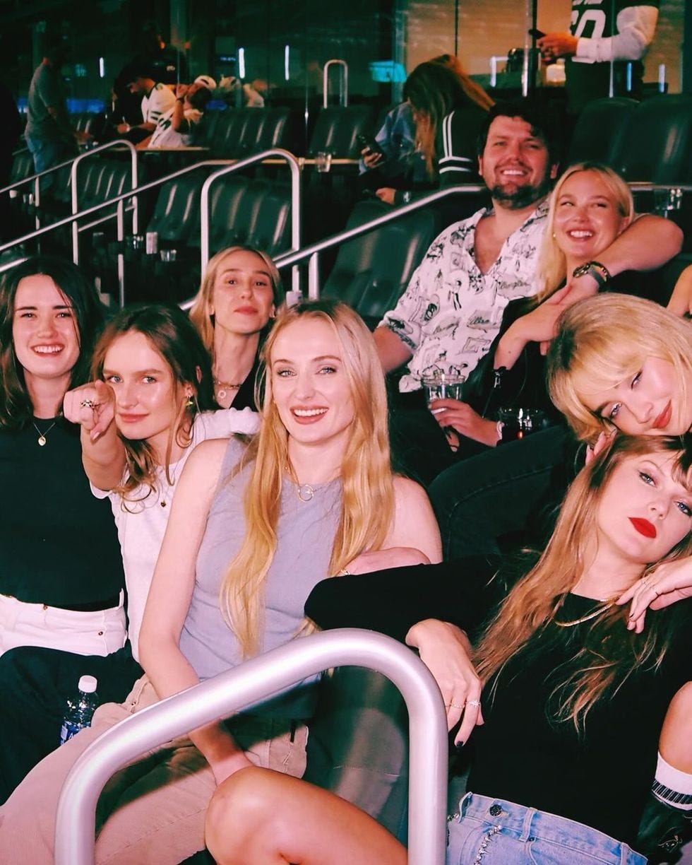 a group of people sitting on a roller coaster