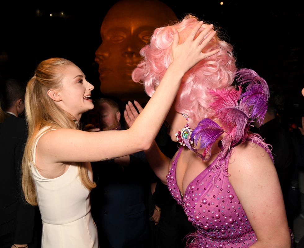 Sophie Turner Goes Solo to 2019 Emmys in Feminine Pink Gown While