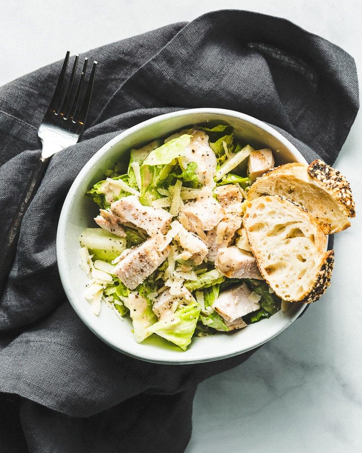 https://hips.hearstapps.com/hmg-prod/images/sous-vide-chicken-caesar-salad-overhead-1588363944.jpg