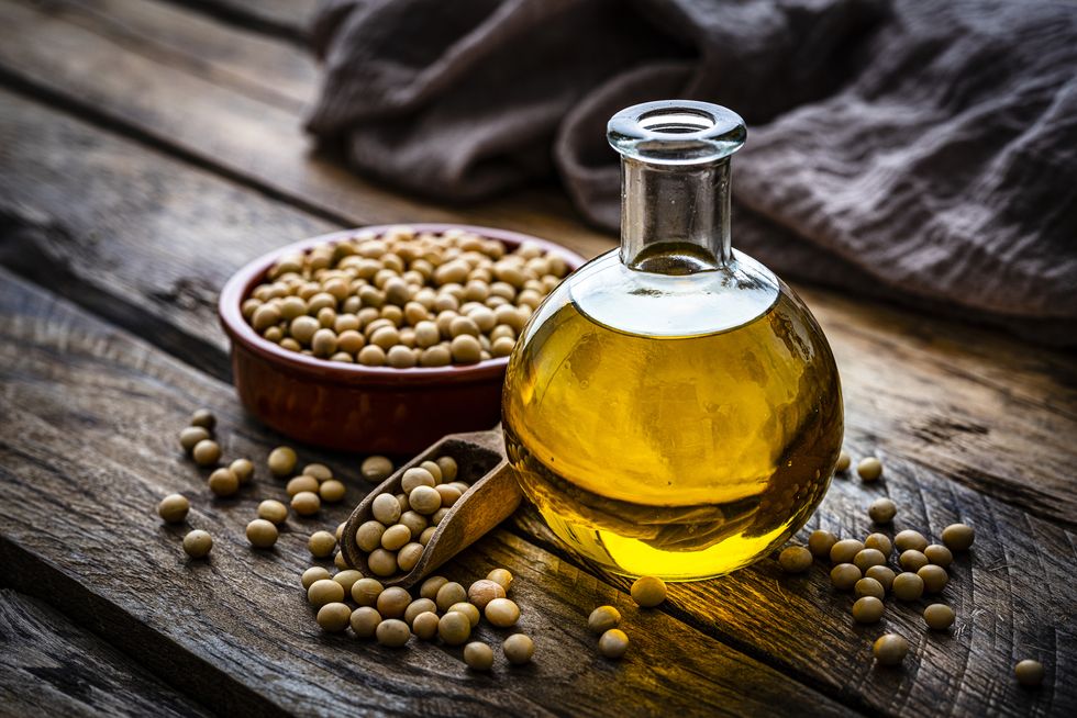 soy oil bottle and dried soybeans