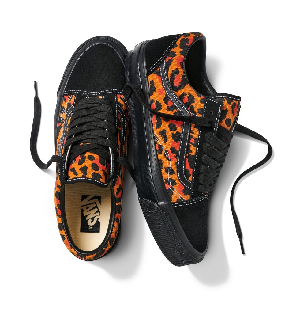 casual sneakers with a black orange and red leopard print design