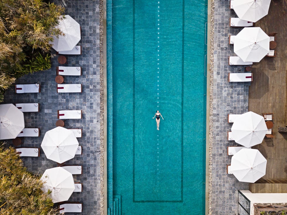 swimmer in pool at ananda ayurvedic spa in the himalayas india