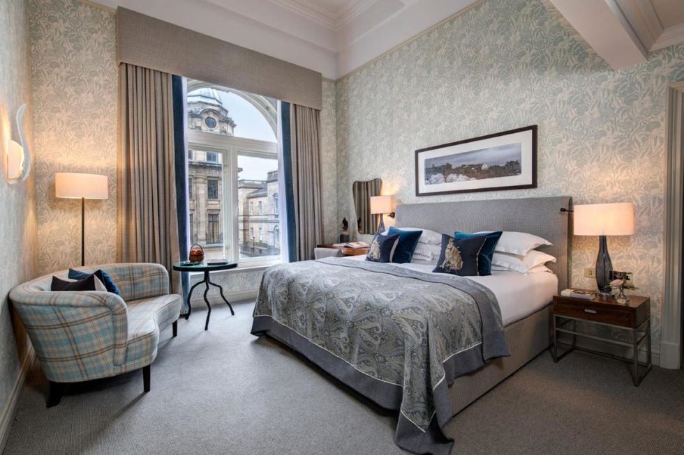 a bedroom with a large window
