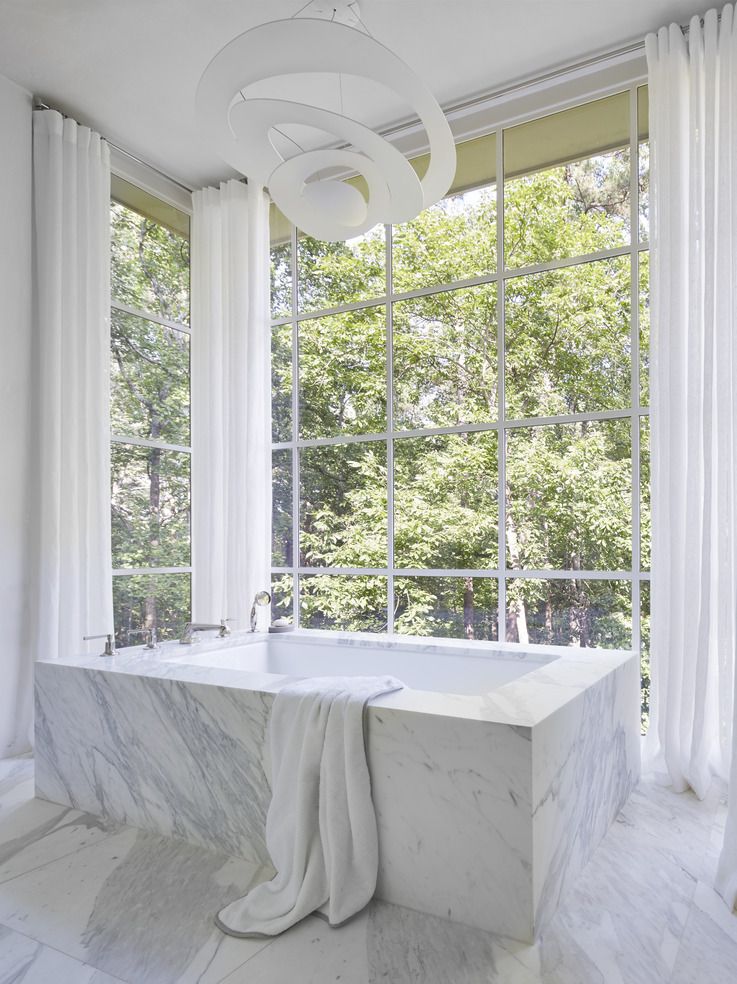 marble bathtub and curtains