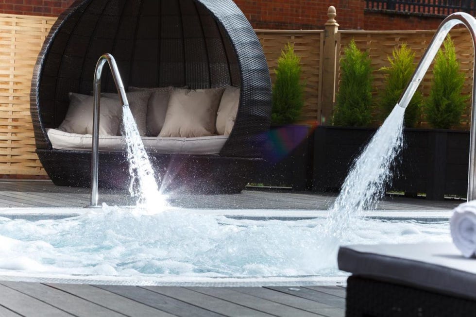 a cabana chair by a hydrotherapy pool