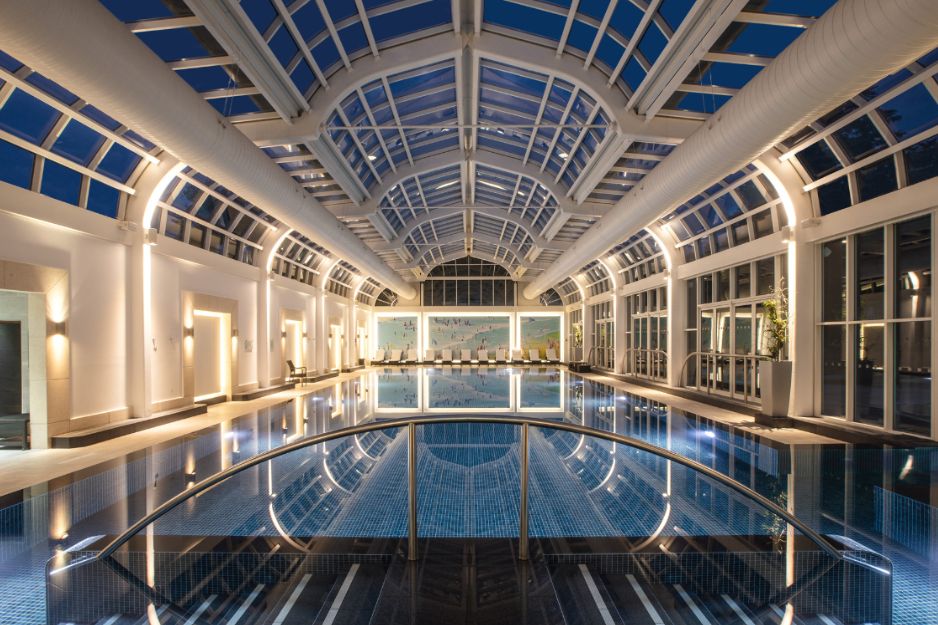 evening shot of spa pool in glass atrium
