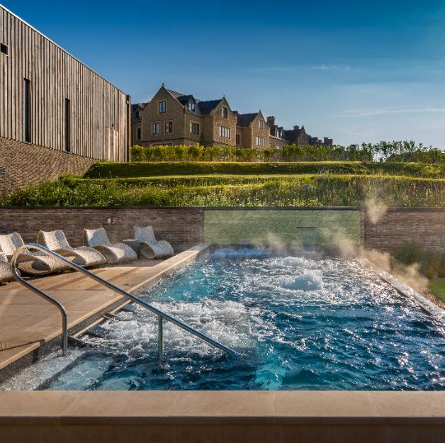 infinity outdoor pool surrounded by gardens