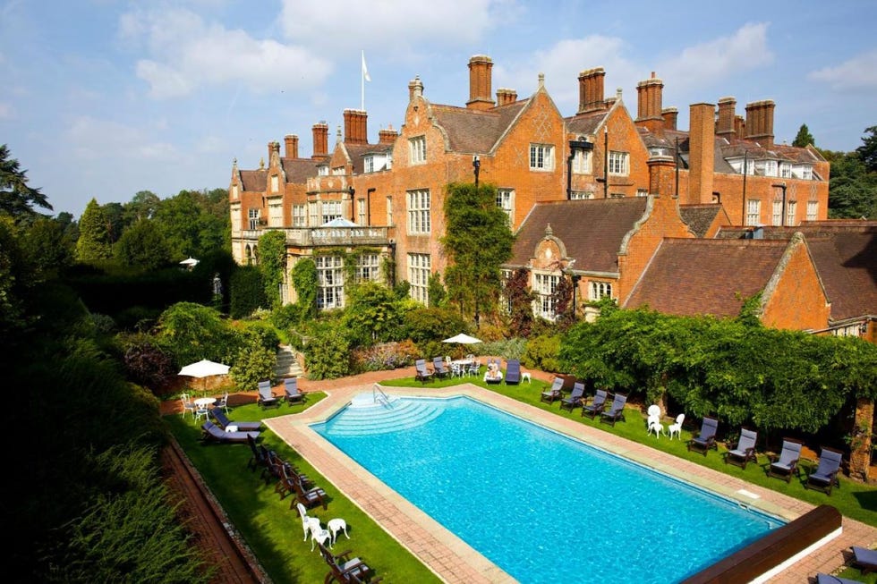 a large house with a pool in front of it