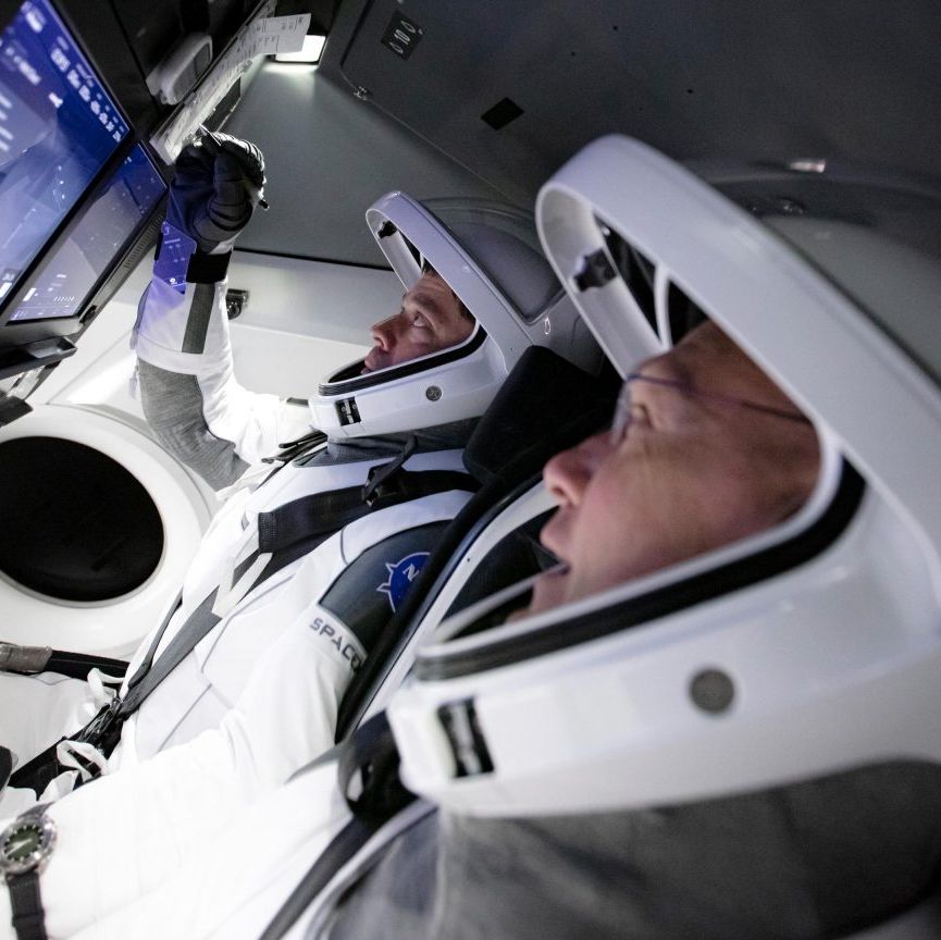 astronauts bob behnken and doug hurley aboard spacex's crew dragon spacecraft