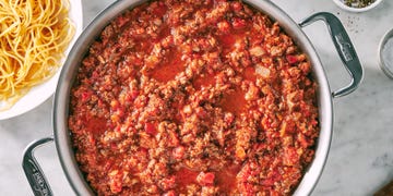 spaghetti sauce with ground beef crushed tomatoes parmesan rind and basil