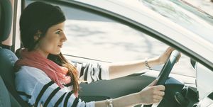 Spain, Barcelona, Young woman in car