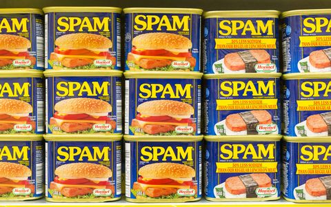 spam canned meat stacked vertically in store shelf spam is
