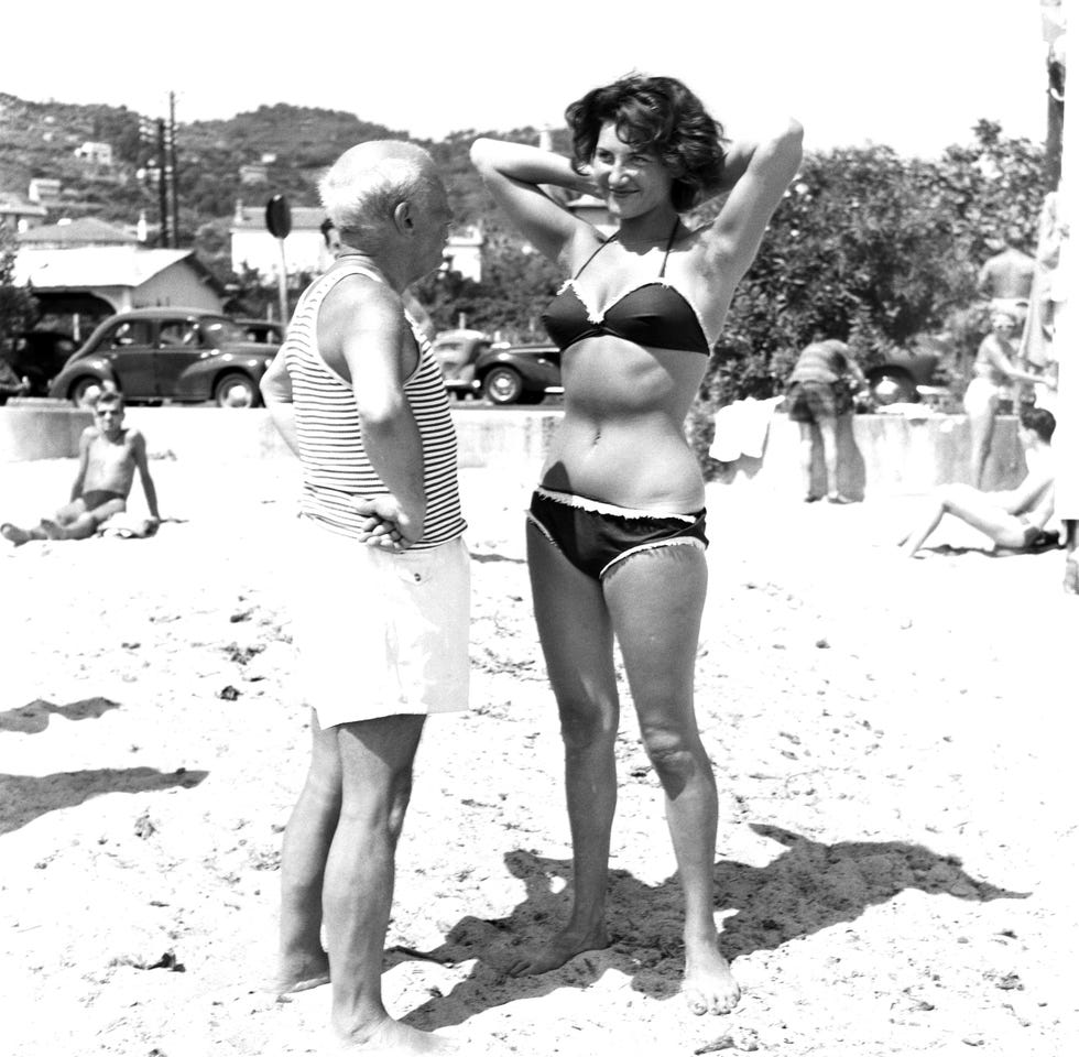 picasso and bikini clad woman on the beach