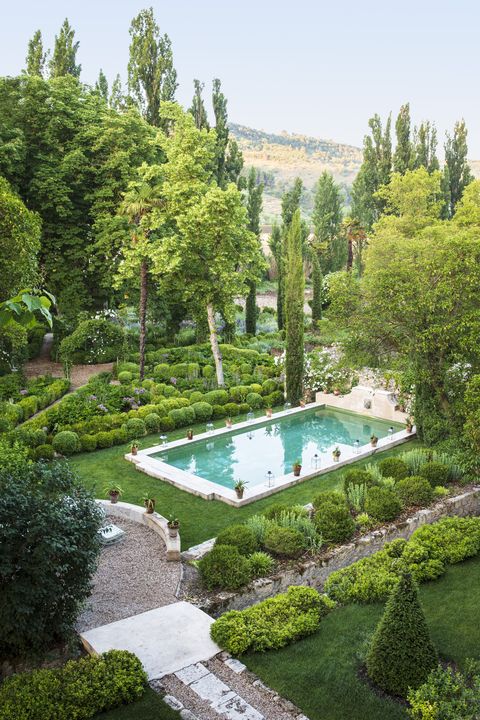 17th century palace in tendilla, spain design by Álvaro sampedro crowned with a sculptural fountain, the pool doubles as a soothing sound feature