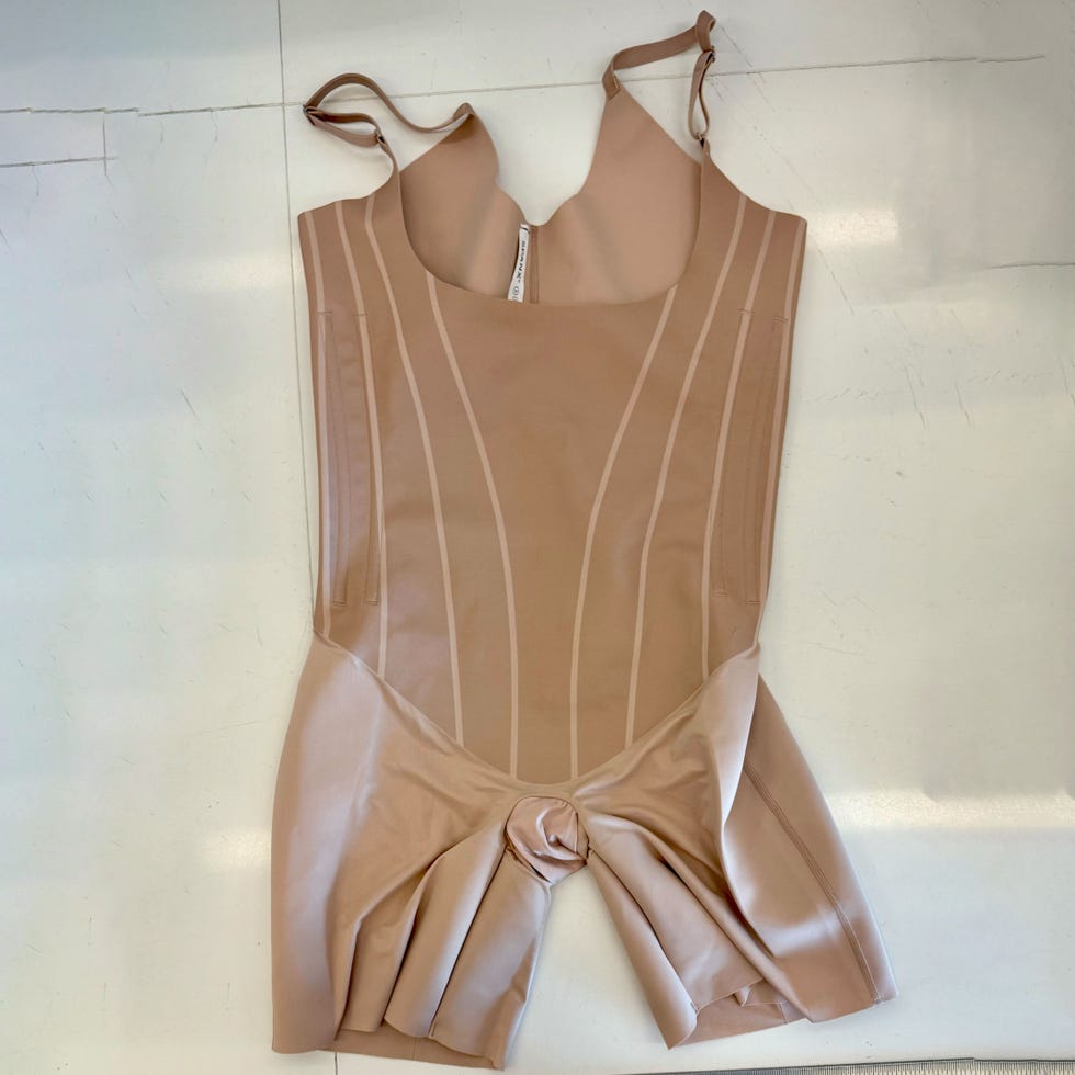 nudetoned fitted bodysuit with vertical seam detailing and adjustable straps