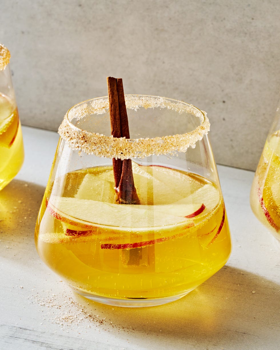 sparkling apple cider sangria with apple slices and cinnamon sticks