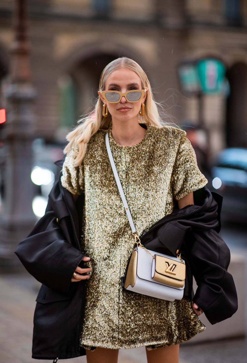 paris, france   october 05 leonie hanne seen wearing golden dress, jacket, white golden bag outside louis vuitton during paris fashion week   womenswear spring summer 2022 on october 05, 2021 in paris, france photo by christian vieriggetty images