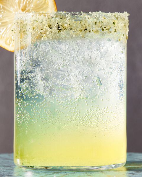 glass of spiked sparkling basil lemonade