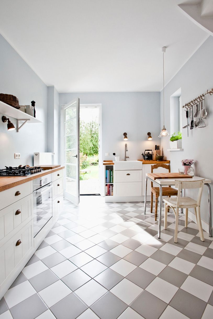 white and grey tiled kitchen with backdoor