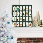 advent calendar on fireplace mantel next to christmas tree holiday decor interior design, fireplace mantel