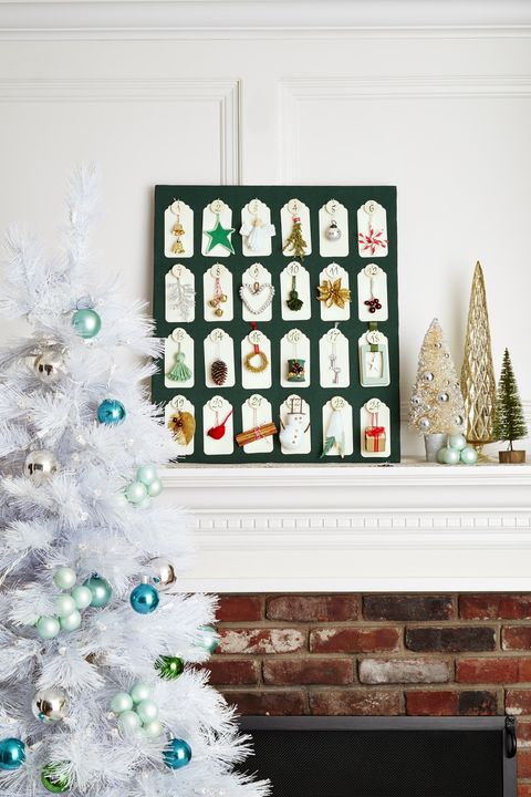 advent calendar on fireplace mantel next to christmas tree holiday decor interior design, fireplace mantel