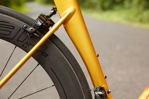 Bicycle wheel, Bicycle part, Bicycle, Vehicle, Bicycle tire, Bicycle frame, Yellow, Tire, Bicycle fork, Hybrid bicycle, 